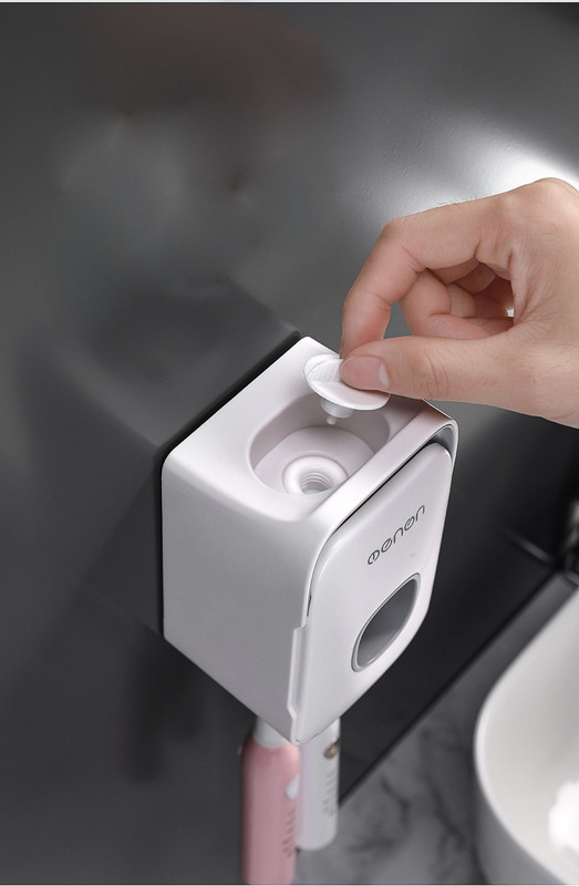 Dantų pastos dozatorius su dantų šepetėlio laikikliu