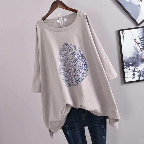 Asimetrični model s 3/4 rukavima i aplikacijom