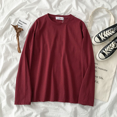 Jednobojna ženska bluza dugih rukava i okruglog dekoltea