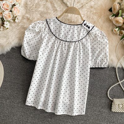 Γυναικεία μπλούζα πουά με στρογγυλή λαιμόκοψη σε λευκό και μαύρο χρώμα
