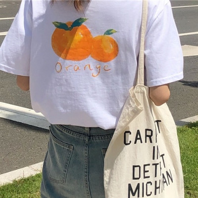 Γυναικείο φαρδύ μπλουζάκι με απλικέ στο πίσω μέρος και 3/4 μανίκια