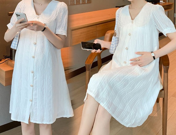 Moderni kratki model ženske haljine s gumbima i špic izrezom za trudnice