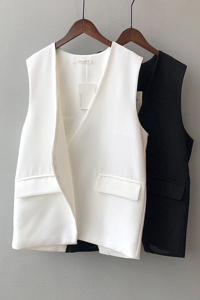 Sieviešu veste ar asimetrisku vesti ar brīvu piegriezumu