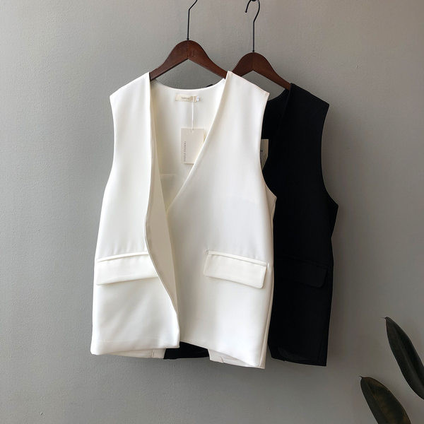 Sieviešu veste ar asimetrisku vesti ar brīvu piegriezumu