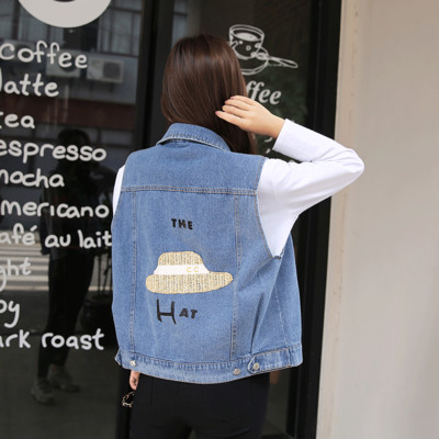 Γυναικείο γιλέκο τζιν με απλικέ μπλε και μαύρο χρώμα