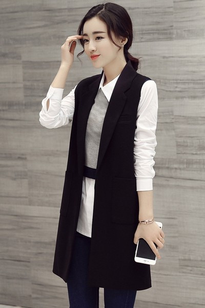 Široki model ženskog prsluka sa džepovima