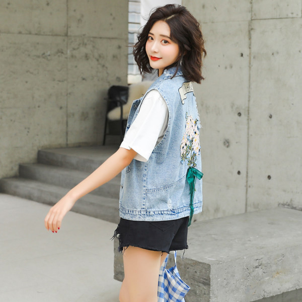 Ženski traper prsluk s vezom i džepovima