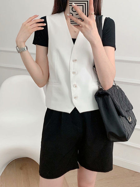 Ležeran ženski prsluk s gumbima i imitacijom džepova