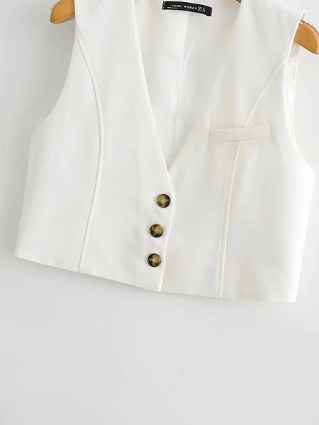 Kratki krojeni prsluk s gumbima i špic izrezom