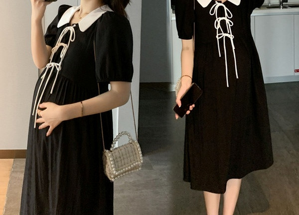 Široki model ženske haljine na vezenje za trudnice