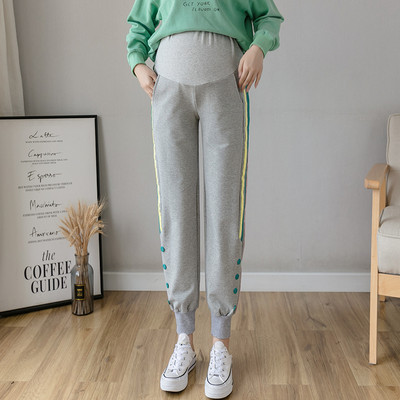 Ženske sportske duge hlače s gumbima i rubom za trudnice