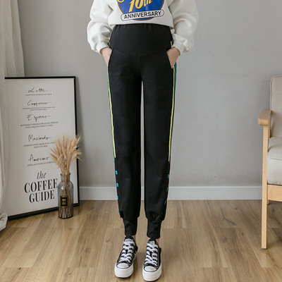 Ženske sportske duge hlače s gumbima i rubom za trudnice