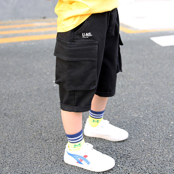 Παιδικό παντελόνι με πλαϊνές τσέπες και μήκος 3/4