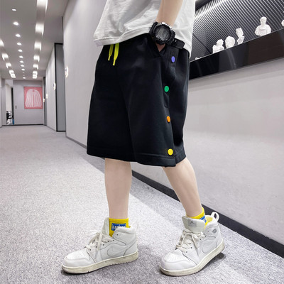 Нов модел детски панталони в бял и черен цвят с цветни пулове и връзки