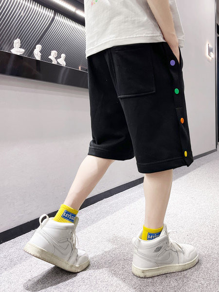 Нов модел детски панталони в бял и черен цвят с цветни пулове и връзки