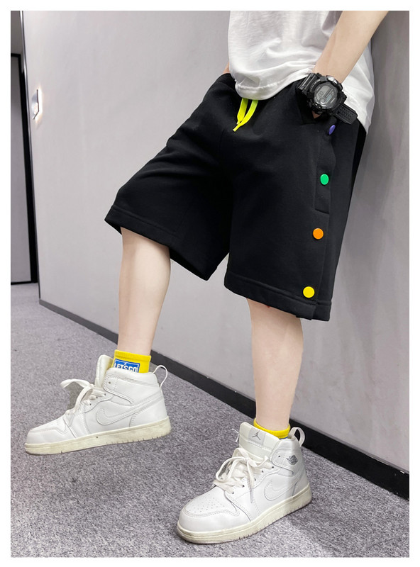 Нов модел детски панталони в бял и черен цвят с цветни пулове и връзки