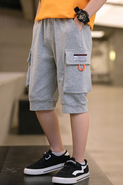 Детски панталони с 3/4 дължина и джобове в два цвята