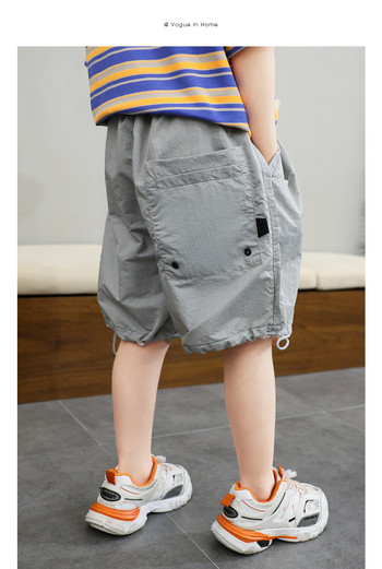 Παιδικό γκρι παντελόνι με τσέπες και κορδόνια