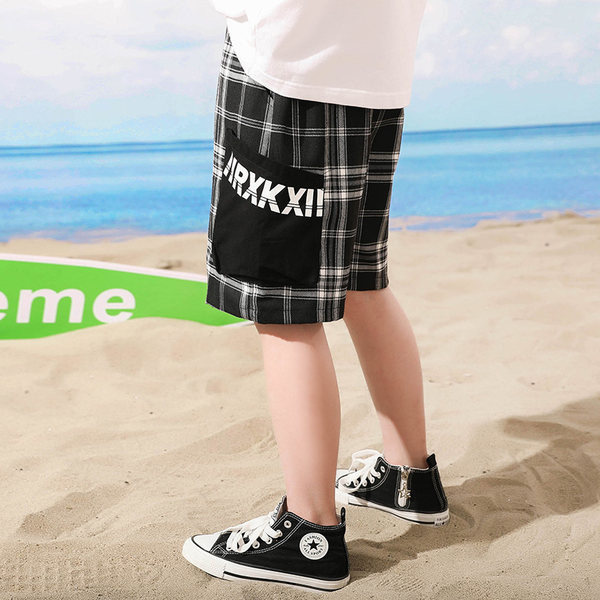 Laste ruudulised lühikesed püksid kirjaga