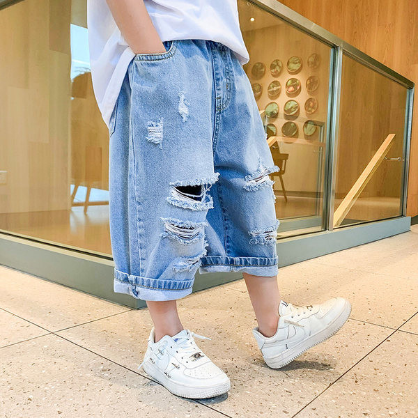 Детски дънкови панталони с разкъсан десен в син цвят 