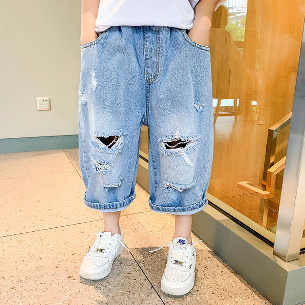 Детски дънкови панталони с разкъсан десен в син цвят 