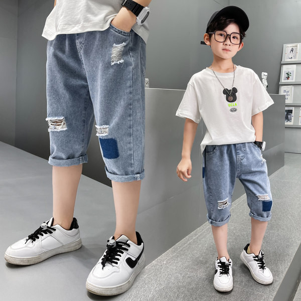 Модерни дънки със скъсани мотиви и ластична талия