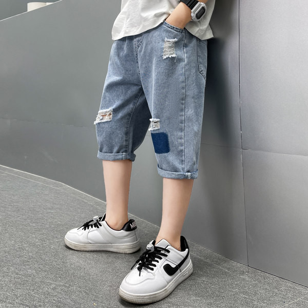 Модерни дънки със скъсани мотиви и ластична талия