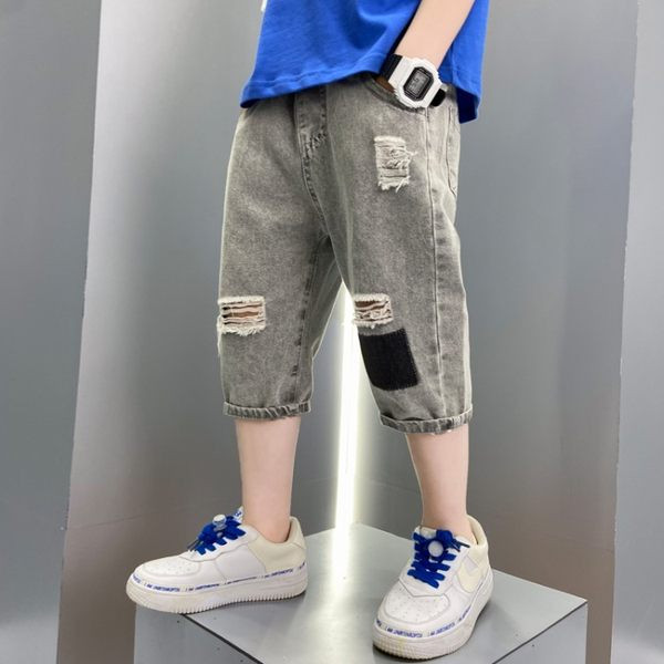 Модерни дънки със скъсани мотиви и ластична талия