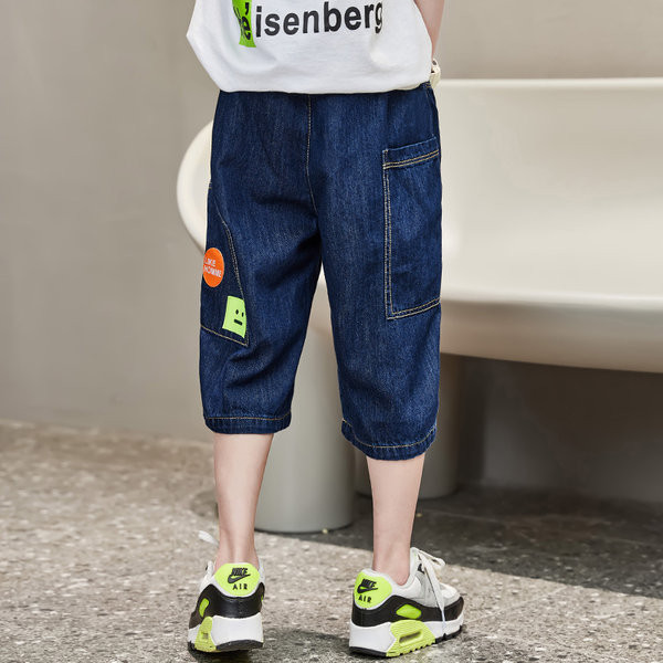 Актуални детски дънки с джобове и връзки 