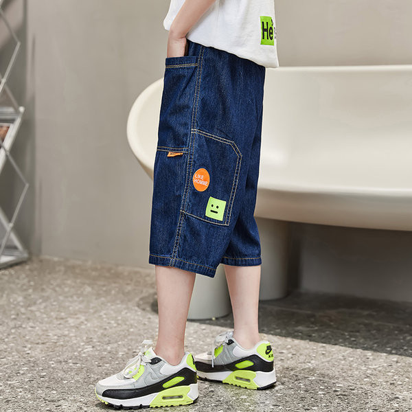 Актуални детски дънки с джобове и връзки 