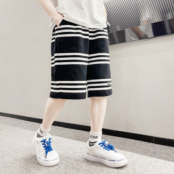 Laste vabaaja laiad taskutega püksid