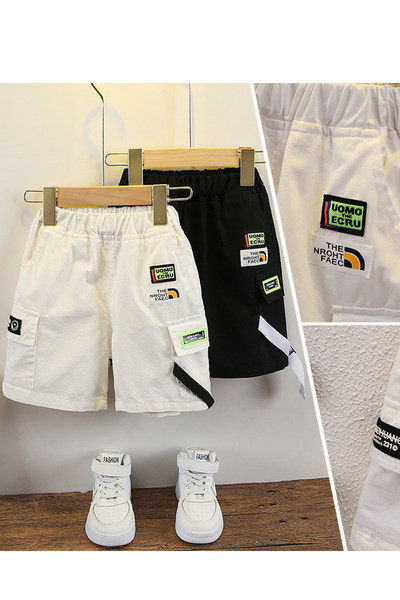 Embleemide ja kummiga vabaaja lastepüksid