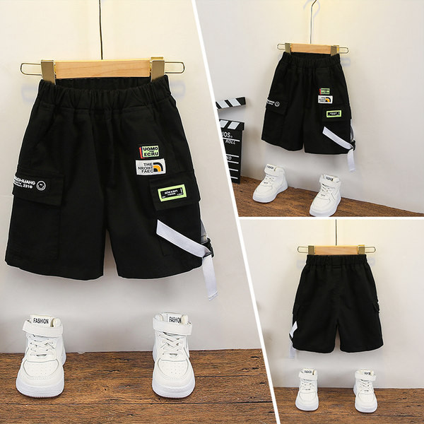 Embleemide ja kummiga vabaaja lastepüksid