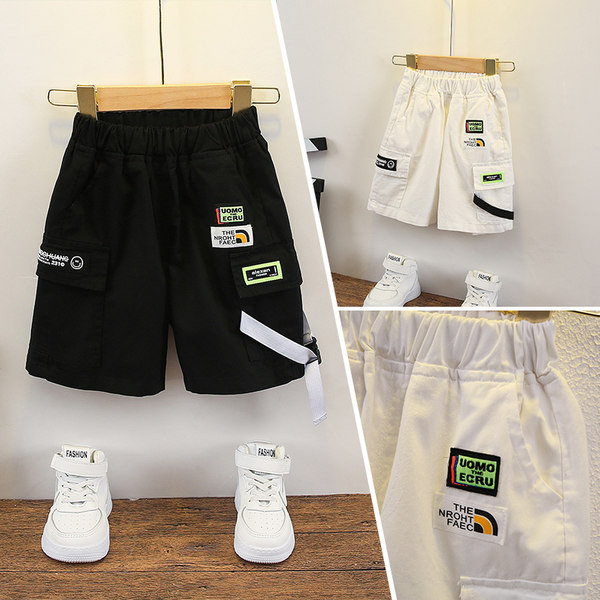 Embleemide ja kummiga vabaaja lastepüksid