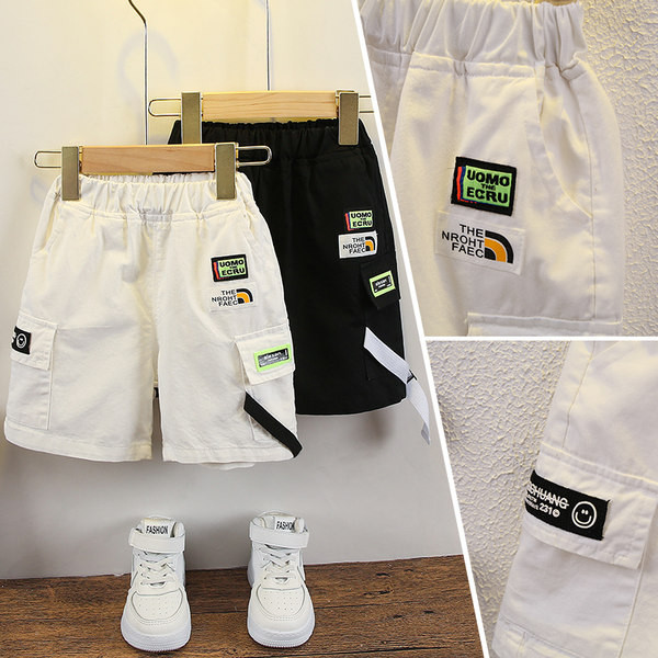 Embleemide ja kummiga vabaaja lastepüksid