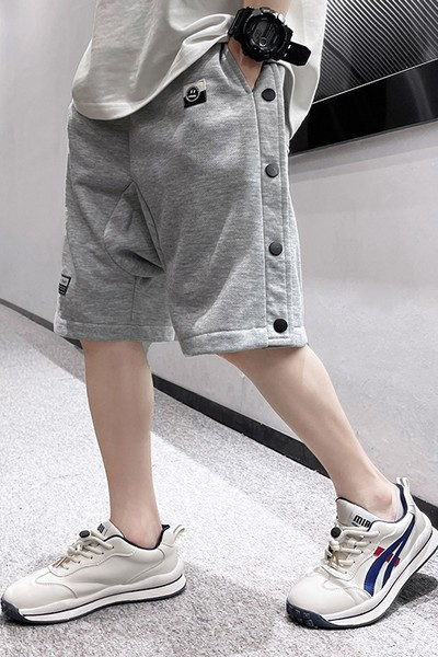 Laste puuvillased nööpide ja taskutega lühikesed püksid