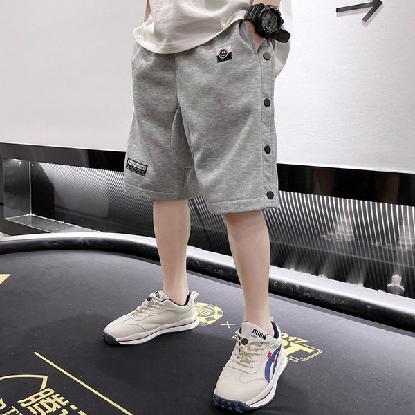 Laste puuvillased nööpide ja taskutega lühikesed püksid