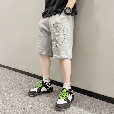 Taskute ja kirjaga laste lühikesed püksid poistele