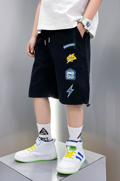 Laste lühikesed püksid tikandite ja lipsudega