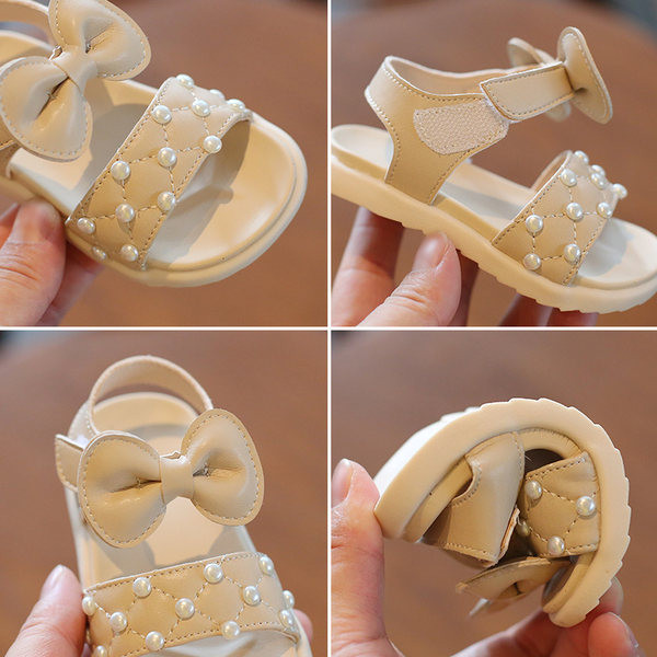 Takjakinnitusega, pärlite ja paelaga beebisandaalid