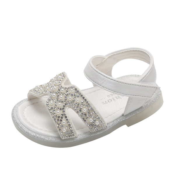 Dekoratiivkivide ja pärlitega beebisandaalid