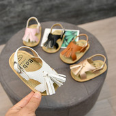 Nahast beebisandaalid tuti ja pandlaga