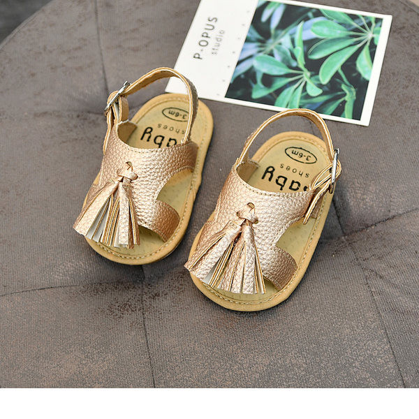 Nahast beebisandaalid tuti ja pandlaga