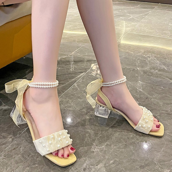 Kandiliste kontsadega pärlite ja paelaga naiste sandaalid