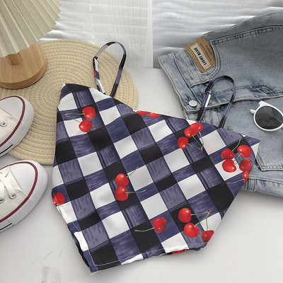 Γυναικεία ασύμμετρη αμάνικη μπλούζα με λεπτούς ιμάντες και απλικέ