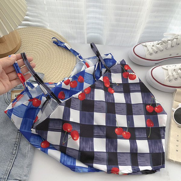 Γυναικεία ασύμμετρη αμάνικη μπλούζα με λεπτούς ιμάντες και απλικέ