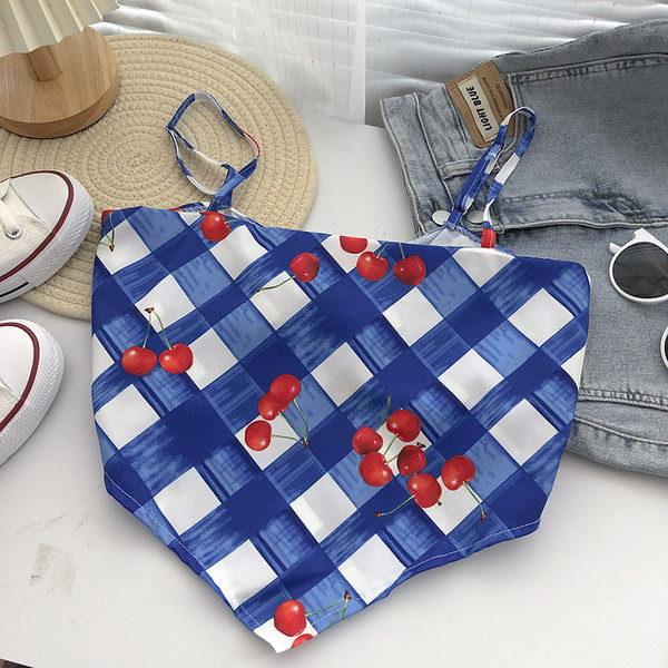 Γυναικεία ασύμμετρη αμάνικη μπλούζα με λεπτούς ιμάντες και απλικέ