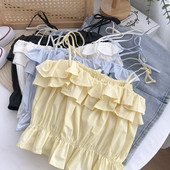 Praegune õhukeste rihmade ja lokkidega topp