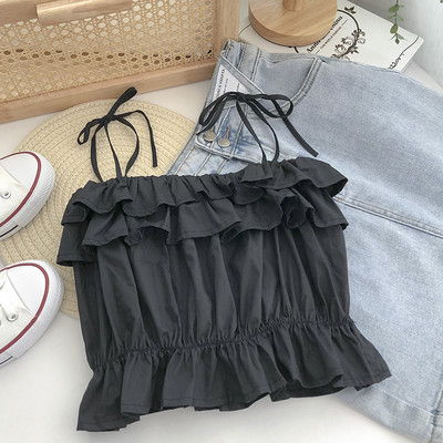 Praegune õhukeste rihmade ja lokkidega topp