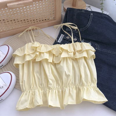 Praegune õhukeste rihmade ja lokkidega topp